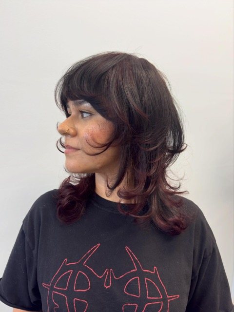 Deep cherry shag with a blunt fringe, front view