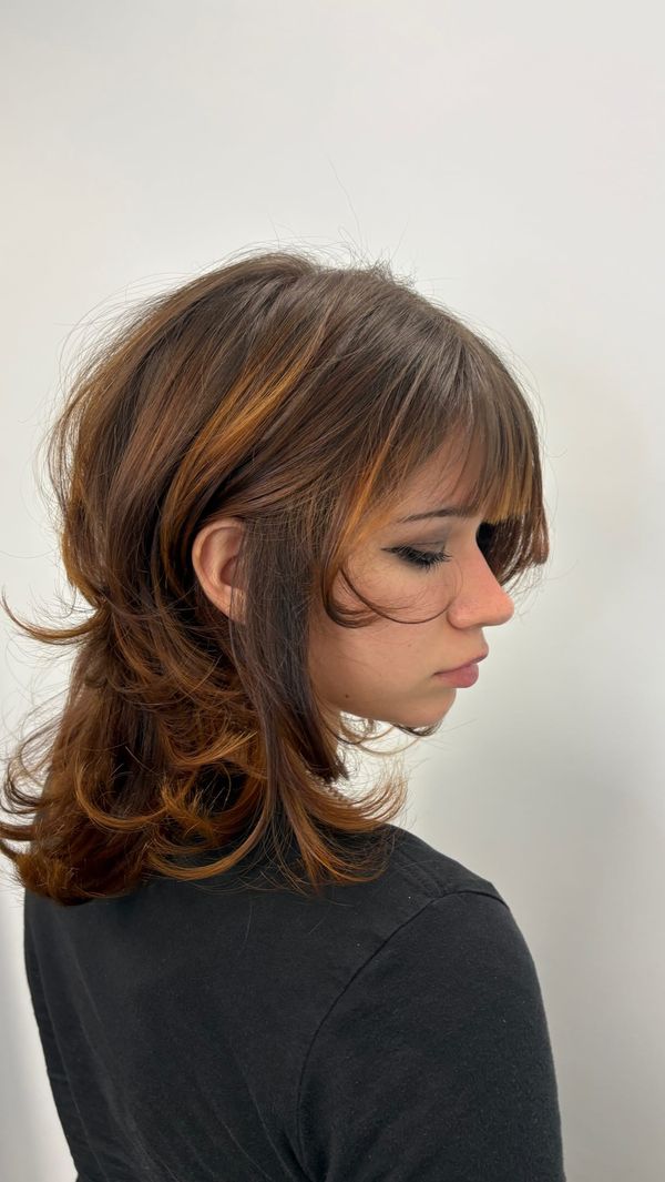 Shag cut with heavy face framing and a soft fringe