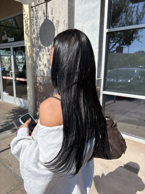 Long black extensions blended into the natural lengths