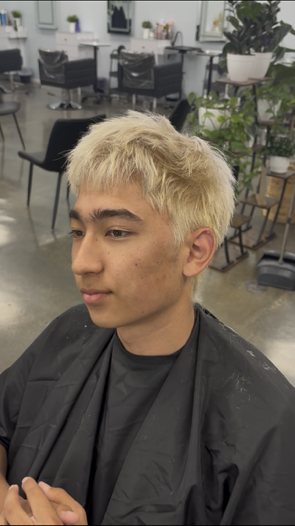 Bleached blonde mens cut with a straight fringe
